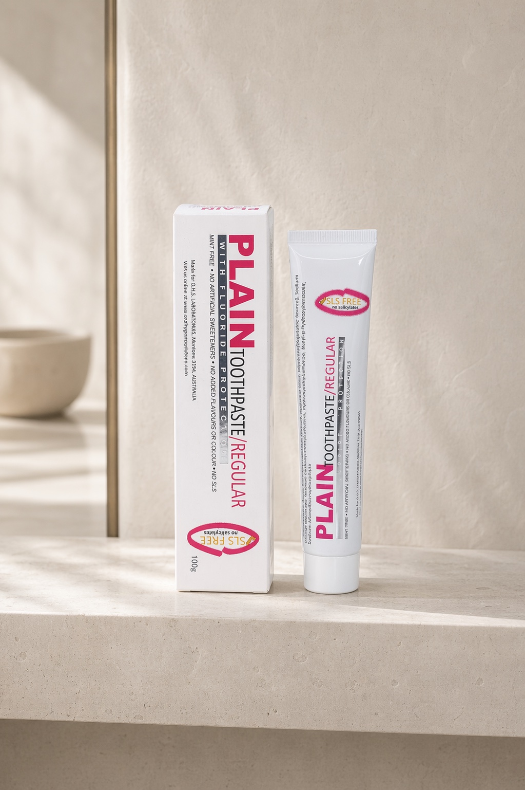 Plain Toothpaste on a cream bathroom vanity